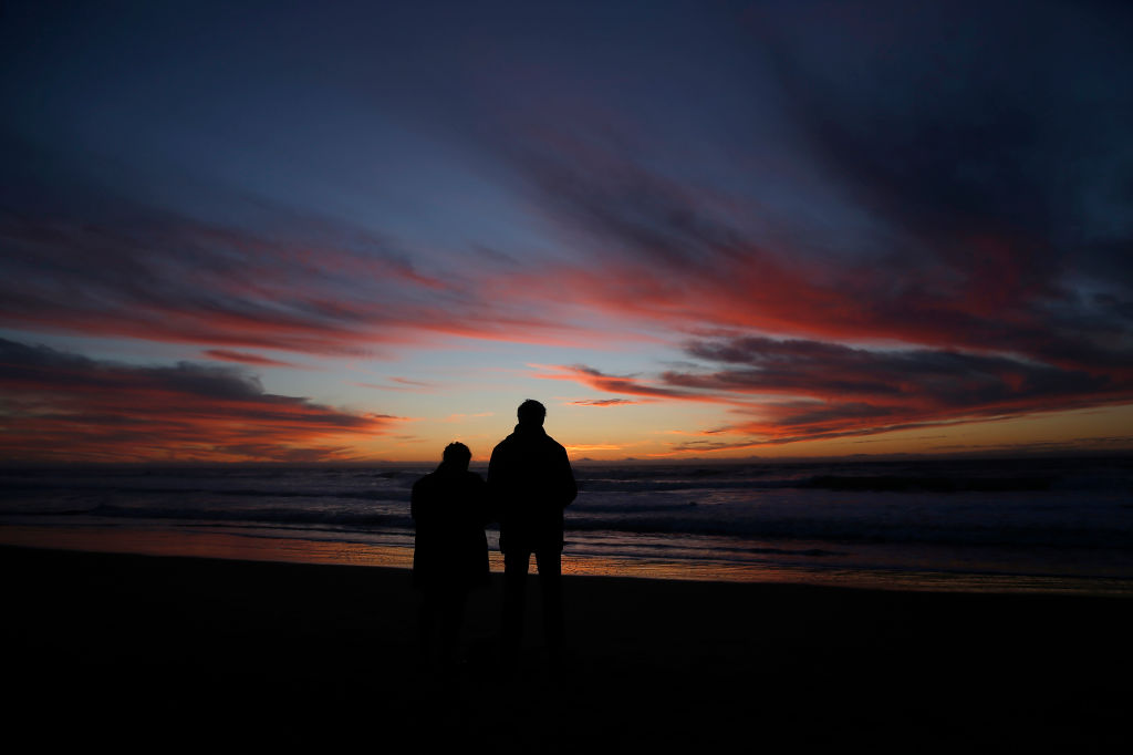 SAN FRANCISCO, CA - DECEMBER 21: People watch the sunset at Ocean Beach in San Francisco, Calif., on Monday, Dec. 21, 2020. Today was the winter solstice, the shortest day of the year and the official start of winter. (Jane Tyska/Digital First Media/East Bay Times via Getty Images)