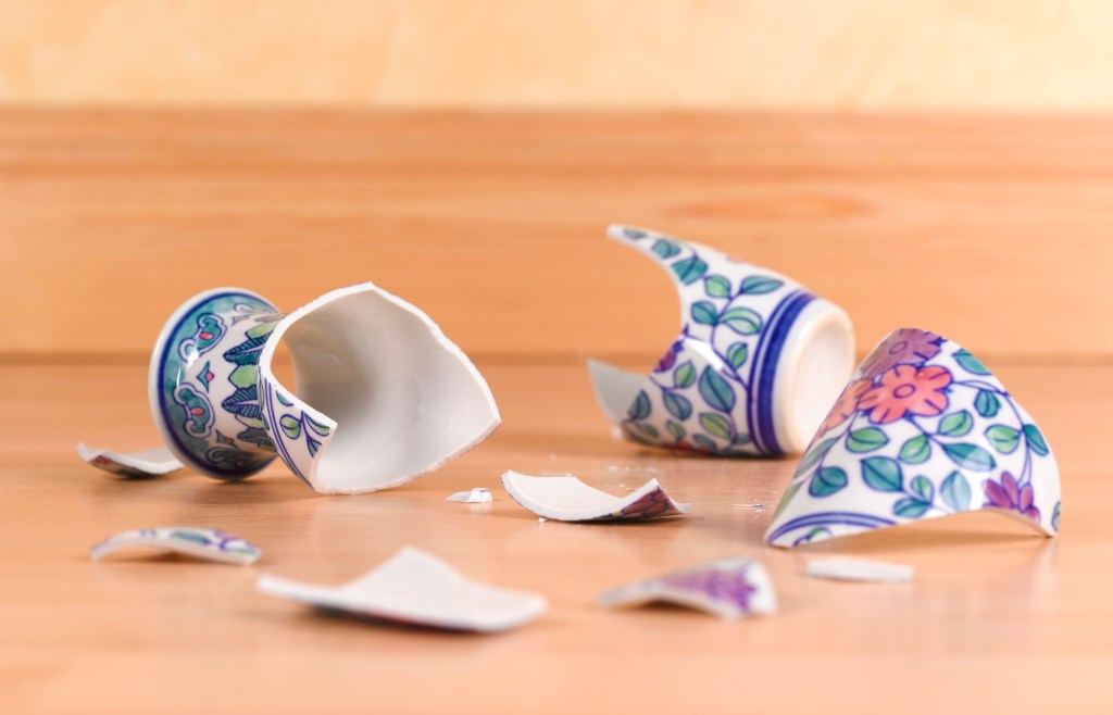 Image of a broken teacup to represent breaking up Big Tech.