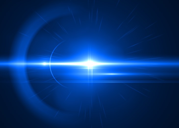 Image of a blue laser beam against a black background.