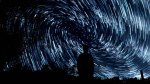 long exposure stars with silhouetted figure