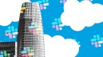 photo illustration of salesforce tower with white clouds and slack logo pattern