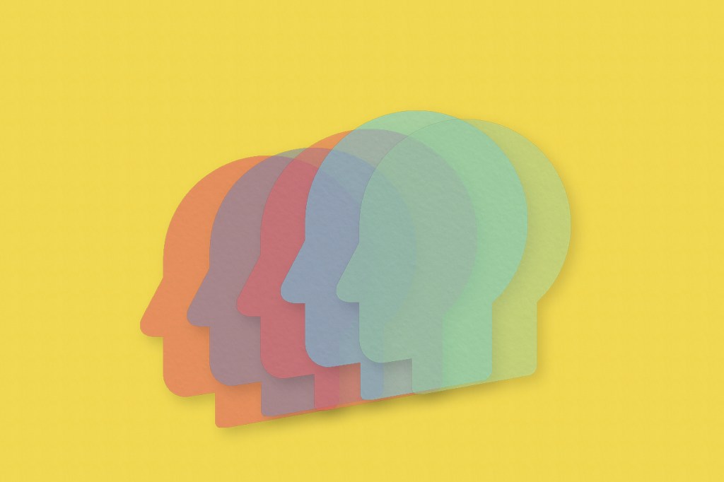 Image of five human heads cut out of paper to represent mental health