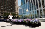 NEW YORK, NEW YORK - MAY 01: A jogger jogs past the Fifth Avenue Blooms Mother's Day installation in front of The Apple store on May 01, 2021 in New York City. (Photo by Michael Loccisano/Getty Images for Fifth Avenue Blooms Mother's Day Installation)