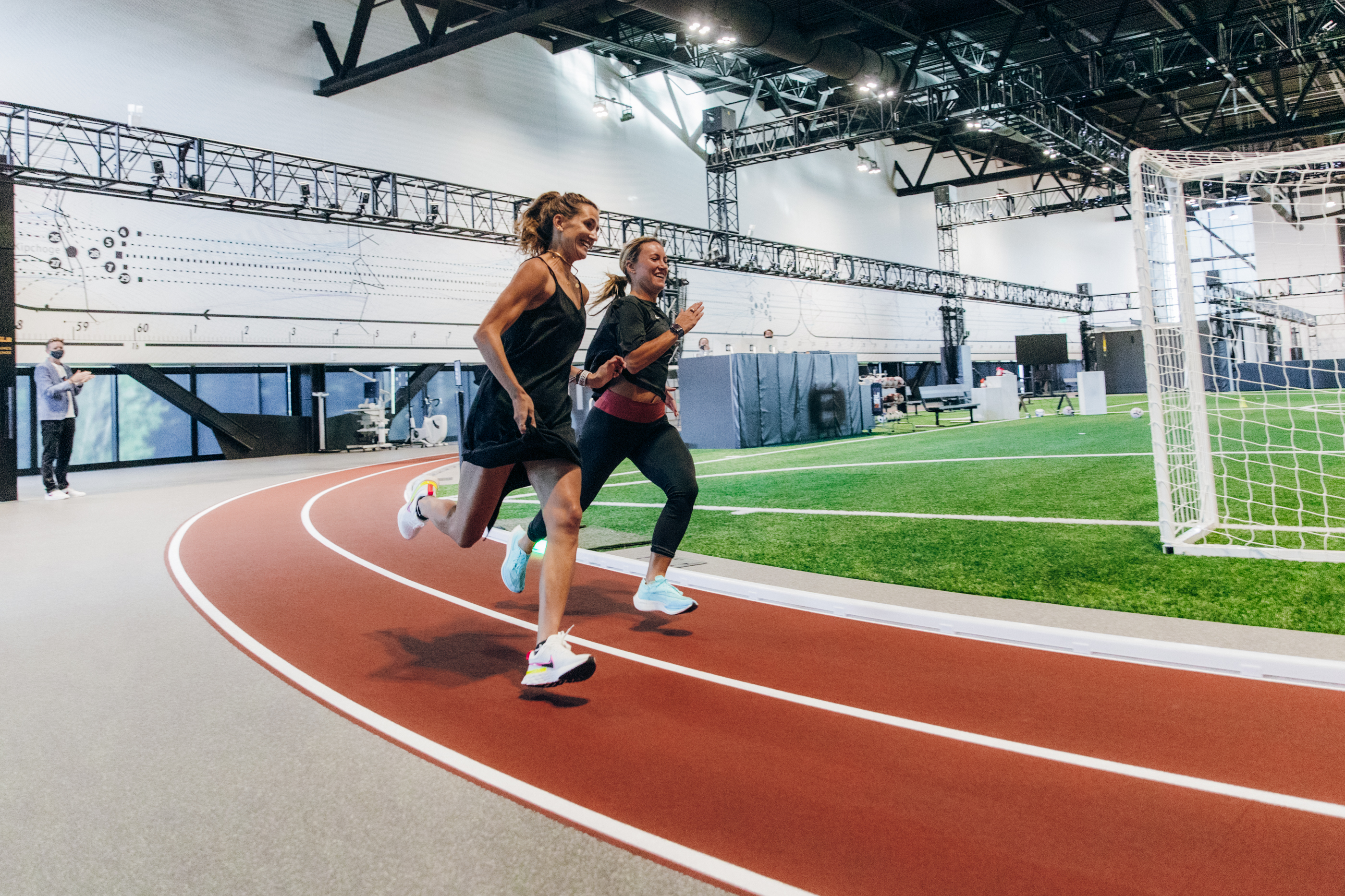 Athletes run on the track at the Nike Sport Research Lab
