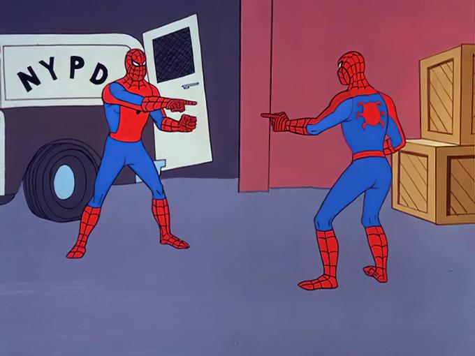 Two identical spidermans pointing at each other