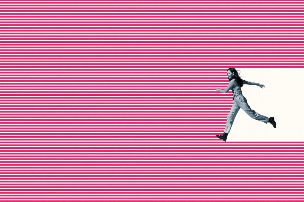 Side view of smiling young woman running on pink striped pattern against white background