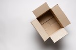 Directly Above Shot Of Open Cardboard Box Over White Background