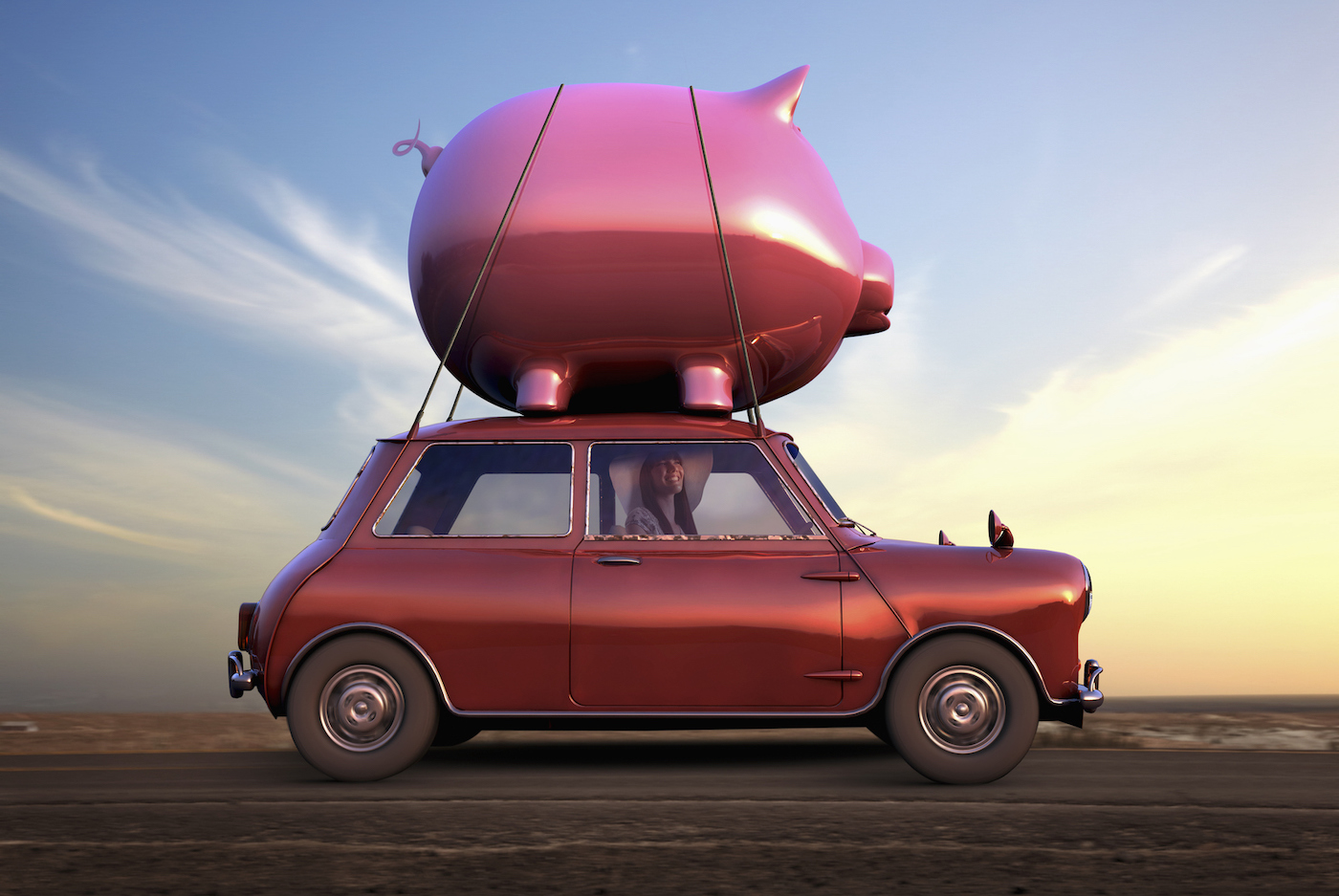 Woman wearing floppy hat driving car with a giant piggy bank on top