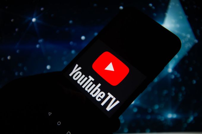 In this photo illustration a Youtube TV logo seen displayed
