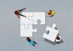 Illustration of four people finishing a puzzle to represent assembling and retaining an inclusive workforce.