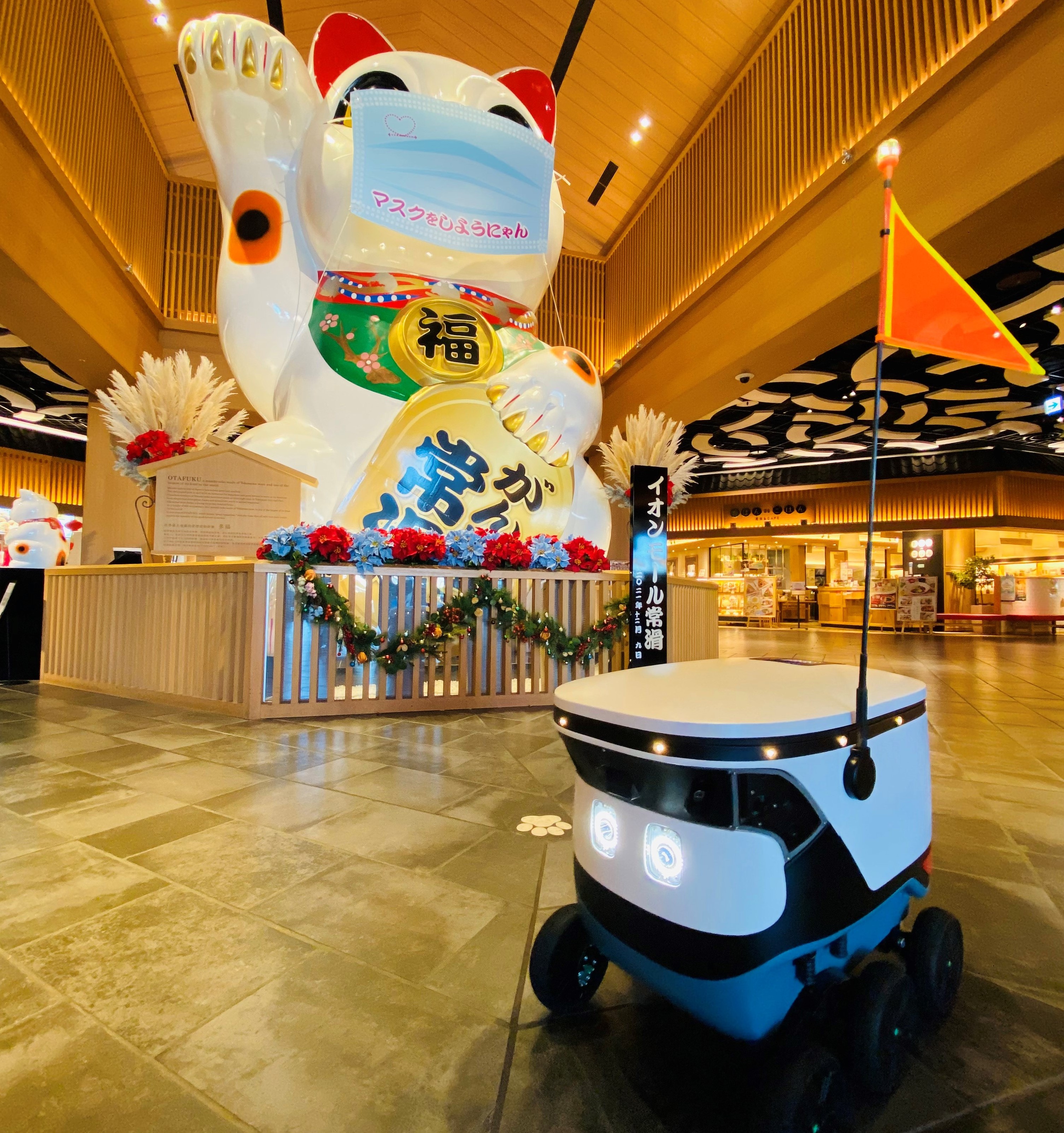Cartken robot in Aeon mall plaza as part of Mitsubishi delivery partnership