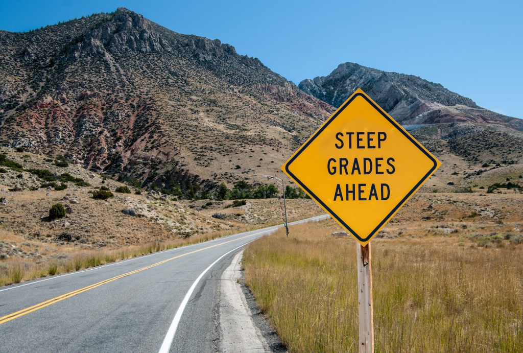 A sign warns of a steep climb ahead on a road leading into the Big Horn Mountains of northeastern Wyoming.