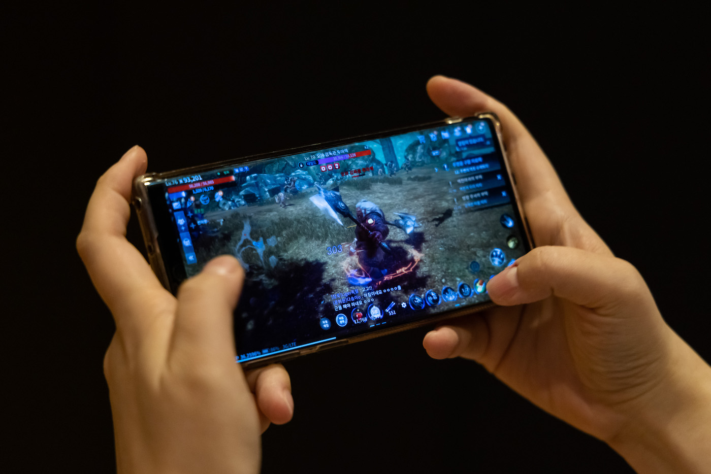 Wemade Co.'s Mir4 mobile game will be available in Seongnam, South Korea, Wednesday, October 6, 2021.  According to blockchain technology, Mir4 allows online players to convert in-game assets into traded crypto coins, but their model is hunting and fighting in the virtual world.  Photographer: SeongJoon Cho / Bloomberg