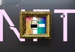 Digital generated image of NFT letters behind golden frame with digital art visualizing blockchain technology and non-fungible token.