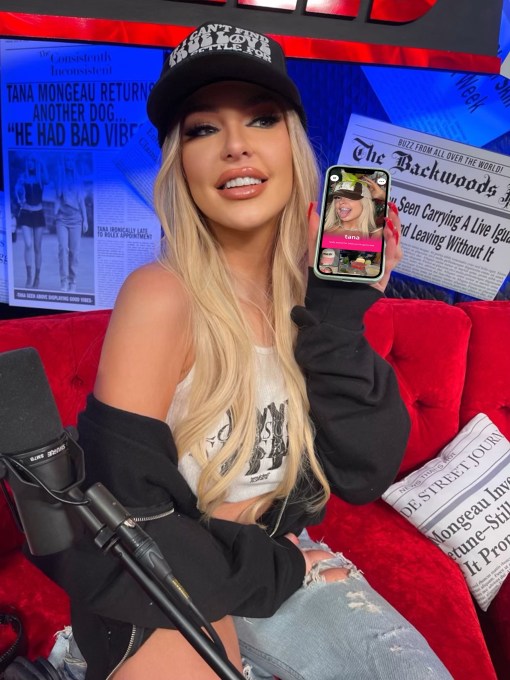 Tana Mongeau with her Roll account open on her phone