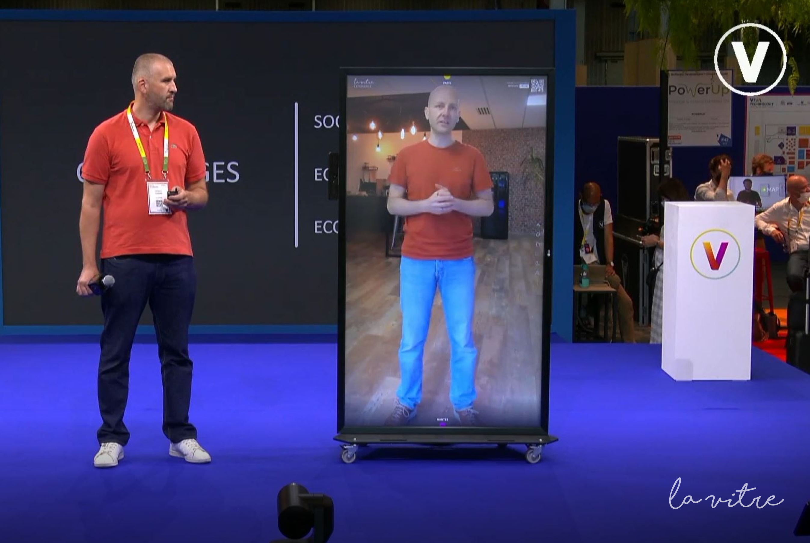 A life-sized image of a person on a video screen doing a video call.