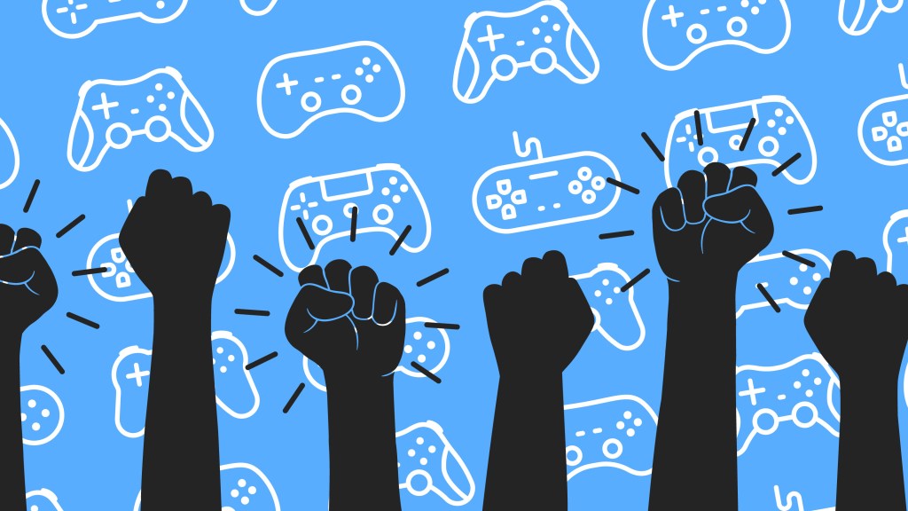 raised fists atop a background with video game consoles