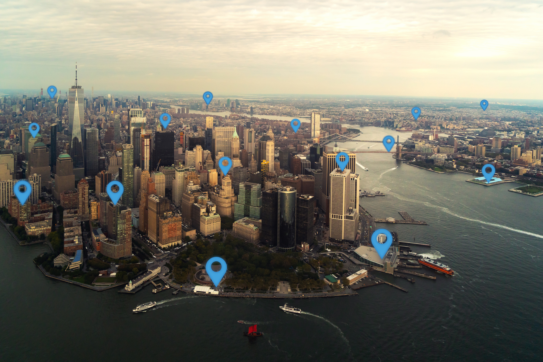 View of NYC with blue location pins overlaid on certain spots