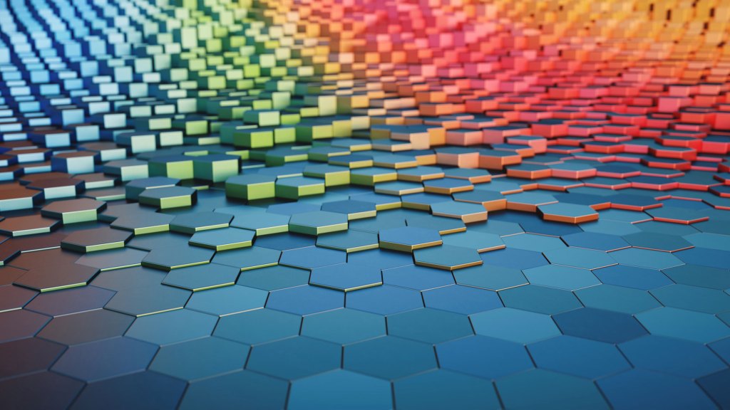 Huge honeycomb structure made of multicolored hexagonal blocks, close-up low angle horizontal composition