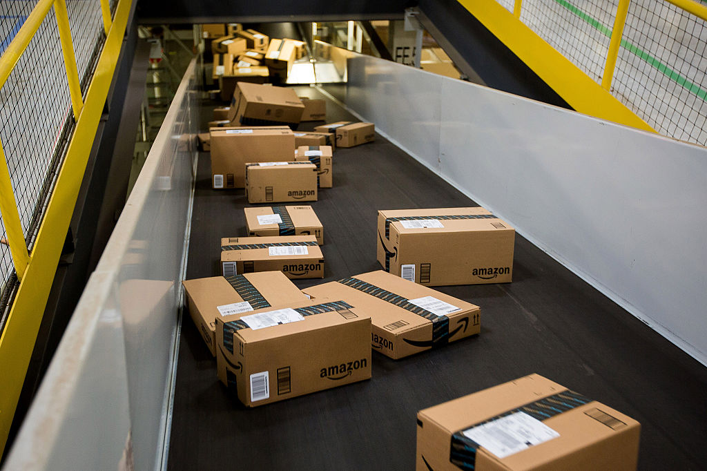 Boxes move along a conveyor belt at the Amazon.com Inc. fulfillment center on Cyber Monday in Robbinsville, New Jersey, U.S., on Monday, Nov. 30, 2015. Online sales on Cyber Monday may rise at least 18 percent from a year earlier, slower growth than during the holiday weekend, as consumers start their Internet shopping earlier, according to forecasts by International Business Machines Corp. Photographer: Michael Nagle/Bloomberg via Getty Images