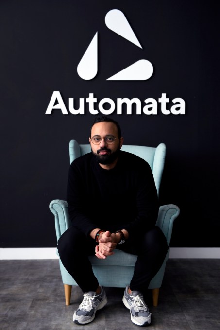 CEO Mostafa ElSayed sits in a chair below the Automata logo.