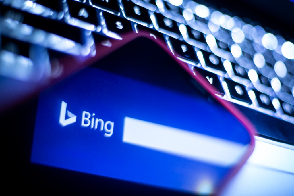 The Microsoft Bing logo is reflected on the computer keyboard.