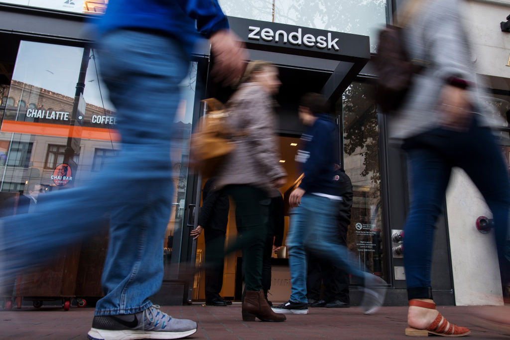 Pedestrians walk past the entrance to Zendesk Inc.  headquarters in San Francisco, California, US, on Wednesday, Oct.  2, 2019. Zendesk fell 5.6% yesterday as its sector declined.  Trading in the company's put options was double the average.  Photographer: David Paul Morris / Bloomberg via Getty Images