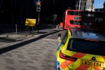 A City of London police patrol car drives through sunlight on Leadenhall in the City of London, the capital's financial district.