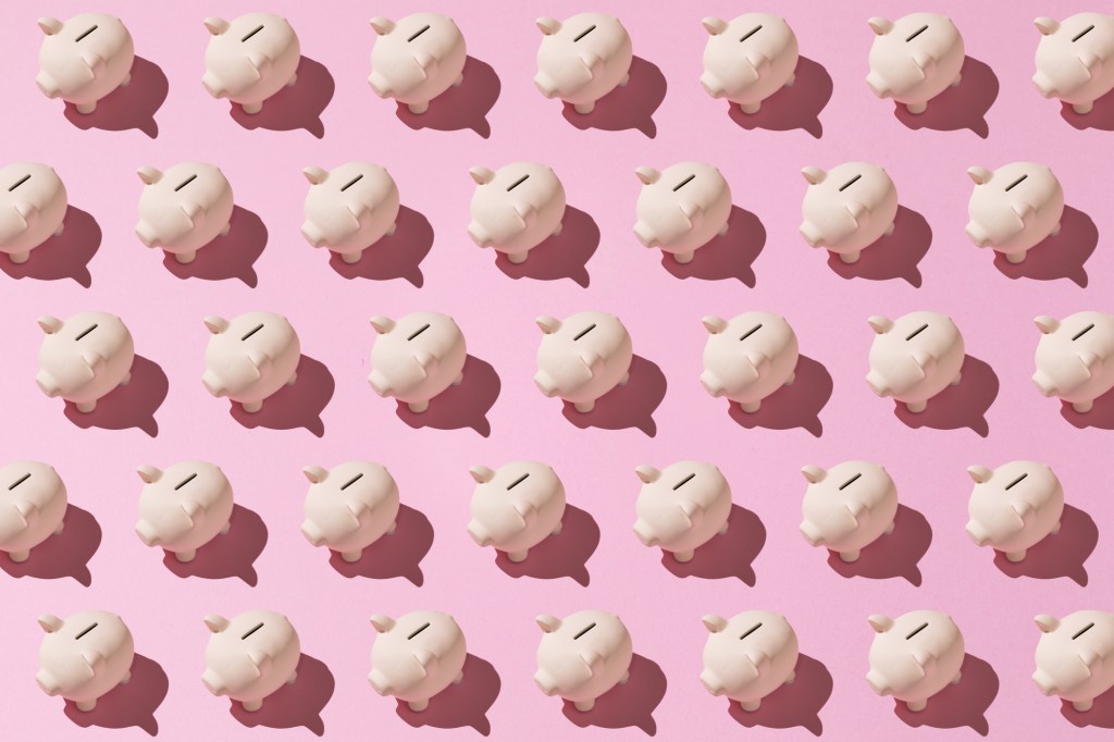 Little pink ceramic piggy bank pattern on pink background. Concept of saving money, savings.