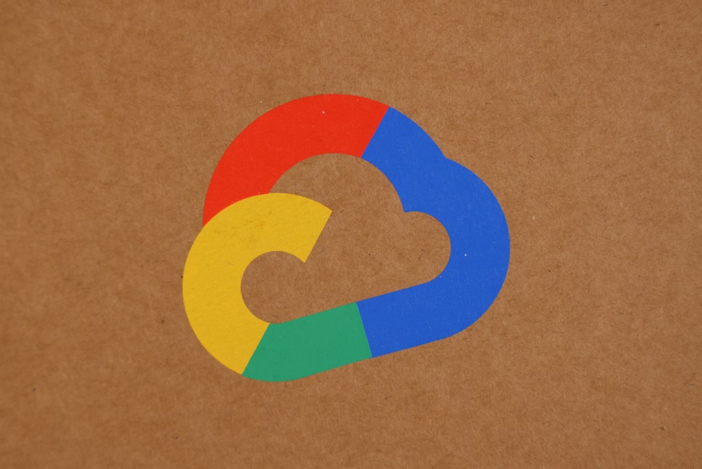 The Google Cloud logo on tan background