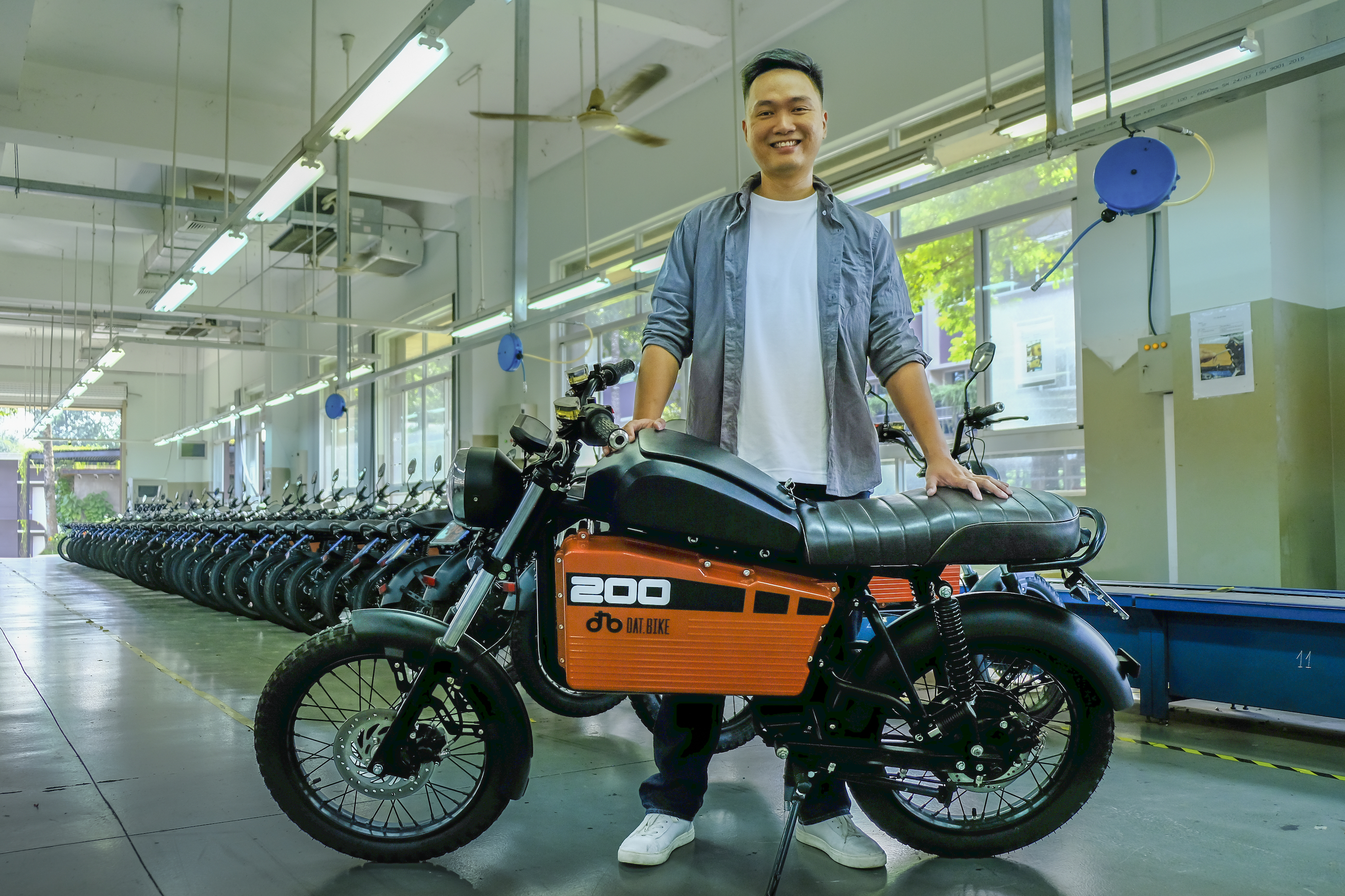 A photo of Son Nguyen, founder and CEO of Dat Bike, with one of the Vietnamese startup's electric motorbikes
