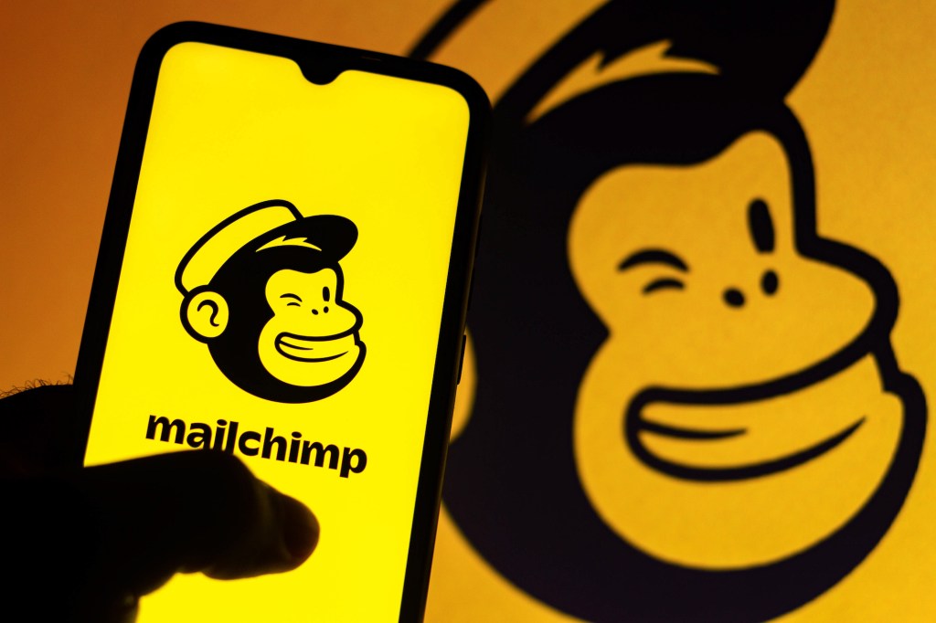 A stock photo of Mailchimp's logo on a yellow background.