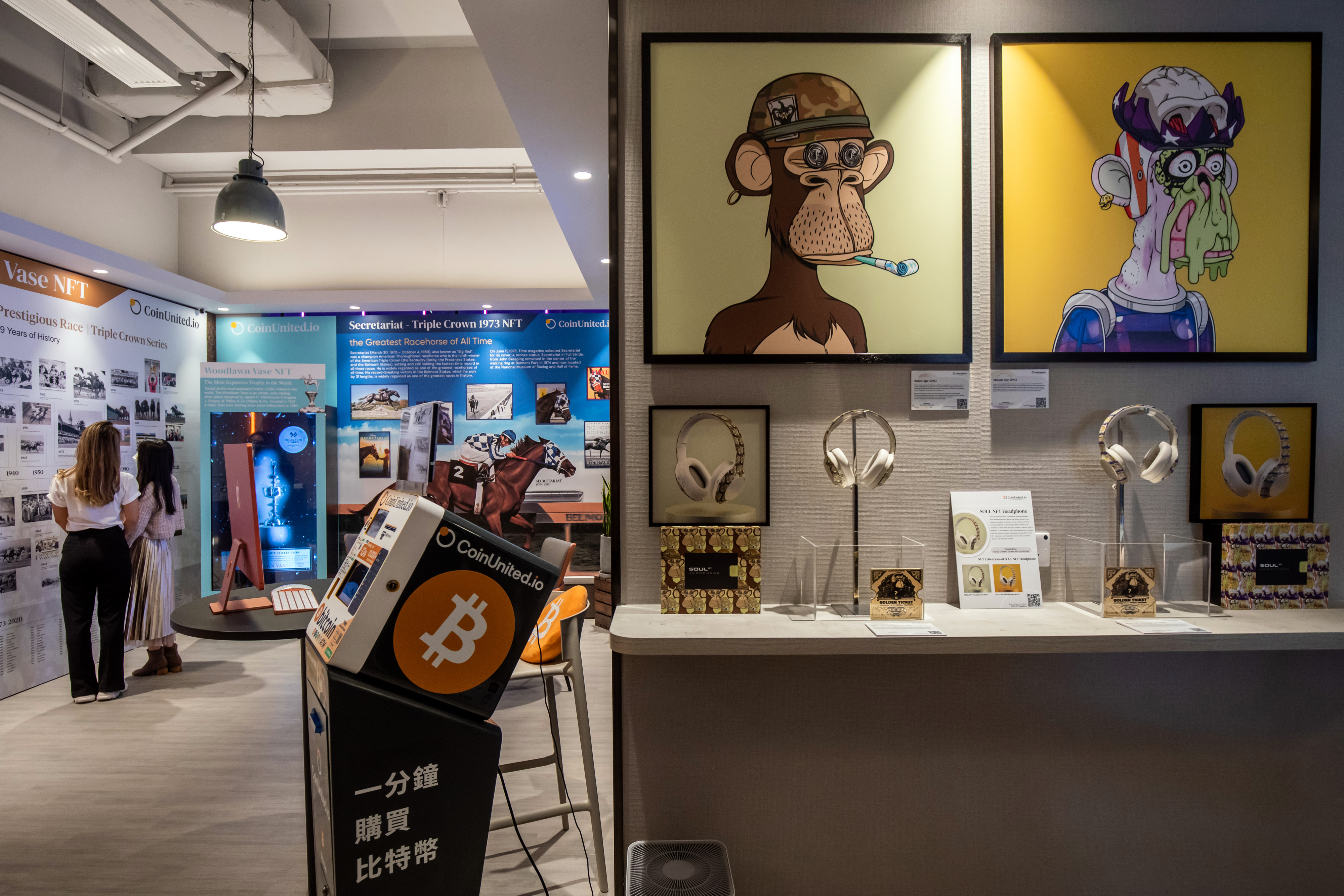 Image of the physical artwork of "Bored Ape # 2967" created by Bored Ape Yacht Club, left, and "Mutant Ape # 1933" created by Mutant Ape Yacht Club, both available for sale as an NFT, displayed at a CoinUnited cryptocurrency exchange in Hong Kong, China, on Friday, March 4, 2022.