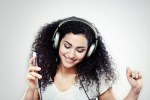 A girl listening to music with headphones on, used in a post about Singaporean startup BandLab