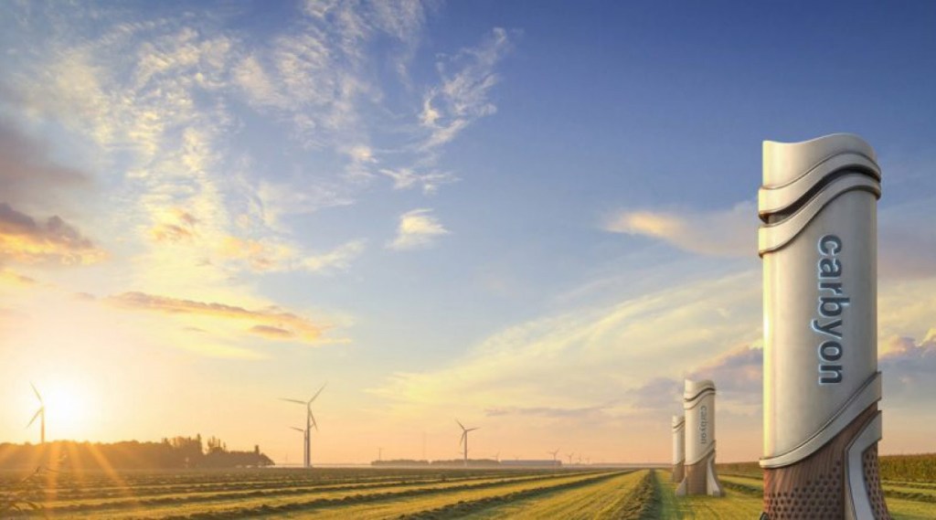 Artists impression of a carbon removal tower in a sunny field.