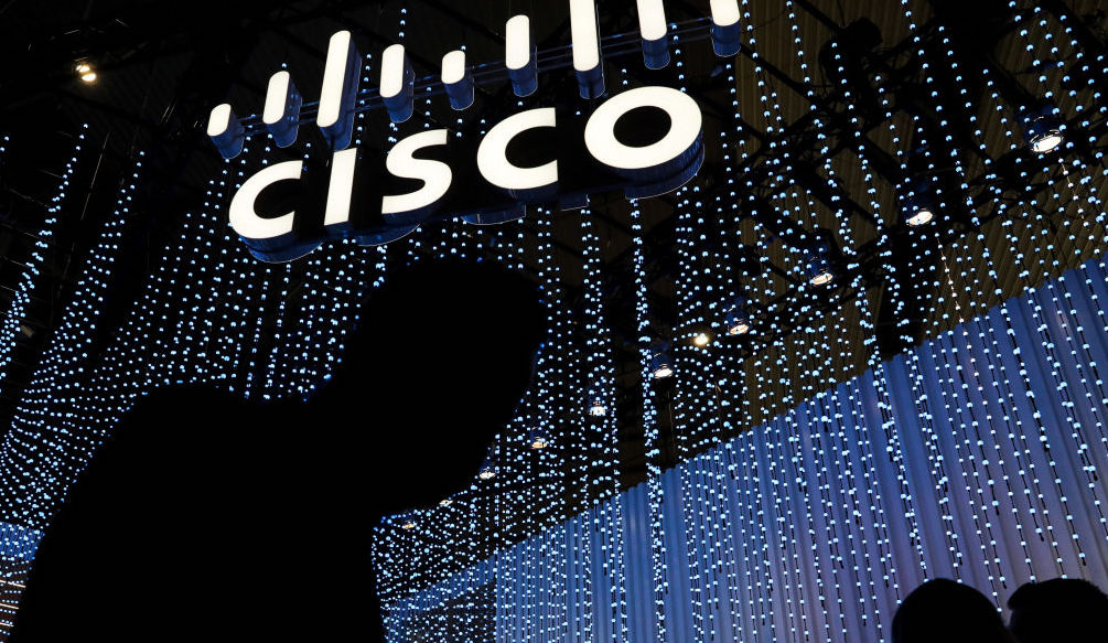 An illuminated logo above the Cisco Systems Inc.  stand on the opening day of the MWC Barcelona at the Fira de Barcelona venue in Barcelona, ​​Spain, on Monday, Feb.  28, 2022. Over 1,800 exhibitors and attendees from 183 countries will attend the annual event, which runs from Feb.  28 to March 3. Photographer: Angel Garcia / Bloomberg