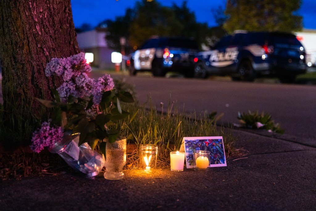 A small vigil set up across the street from a Tops grocery store on Jefferson Avenue in Buffalo, where a heavily armed 18-year-old White man entered the store in a predominantly Black neighborhood and shot 13 people, killing ten, Saturday, May 14, 2022.