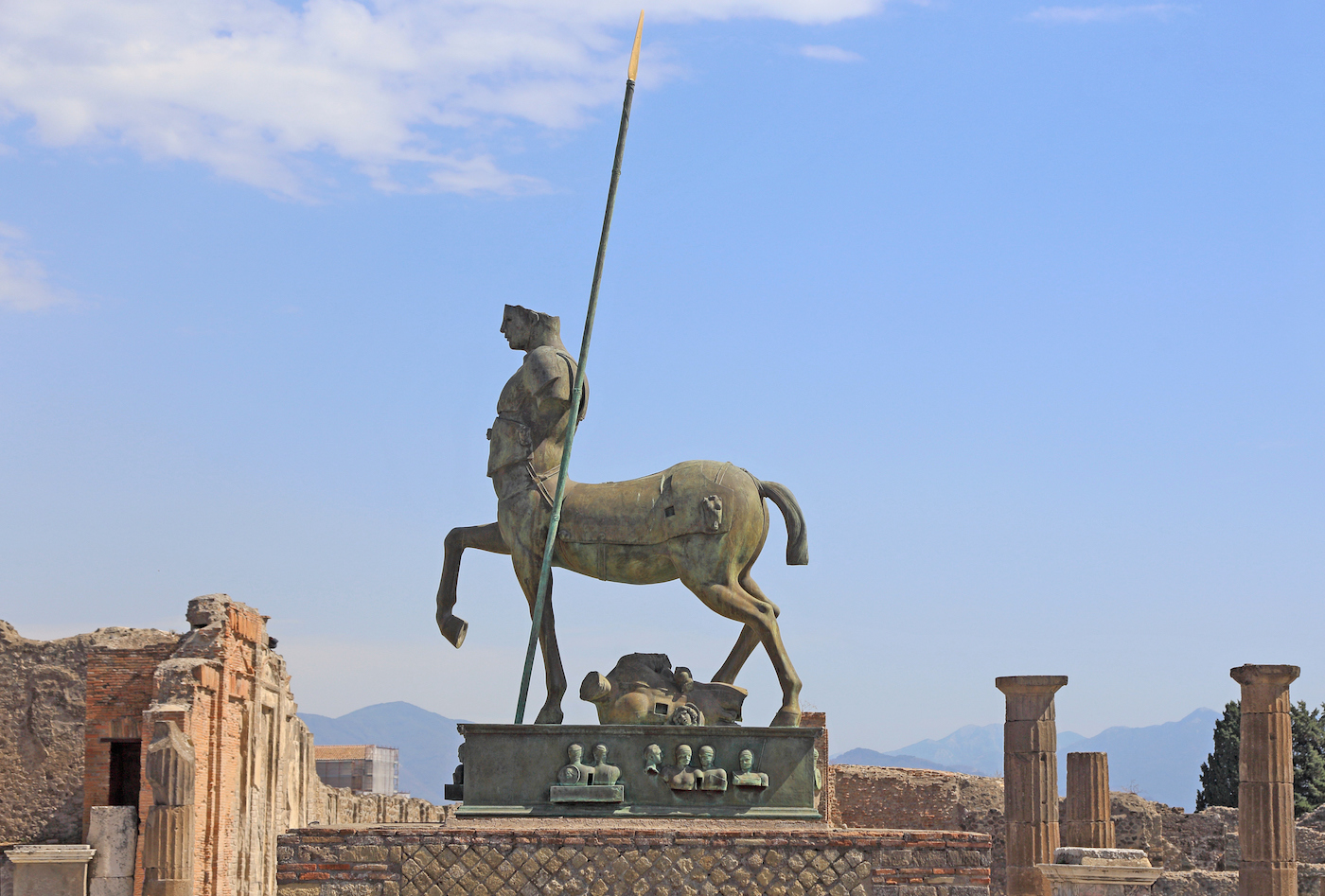 view of a bronze statue of a centaur in the ruins of the archaeological site of Pompeii Italy seen in September 2017