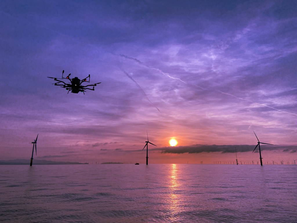 A drone checks the health of wind turbines.