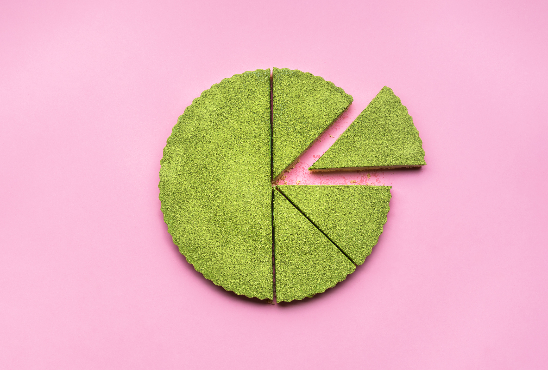 Sliced ​​matcha cheesecake on a pink seamless background.  pro rata rights startups