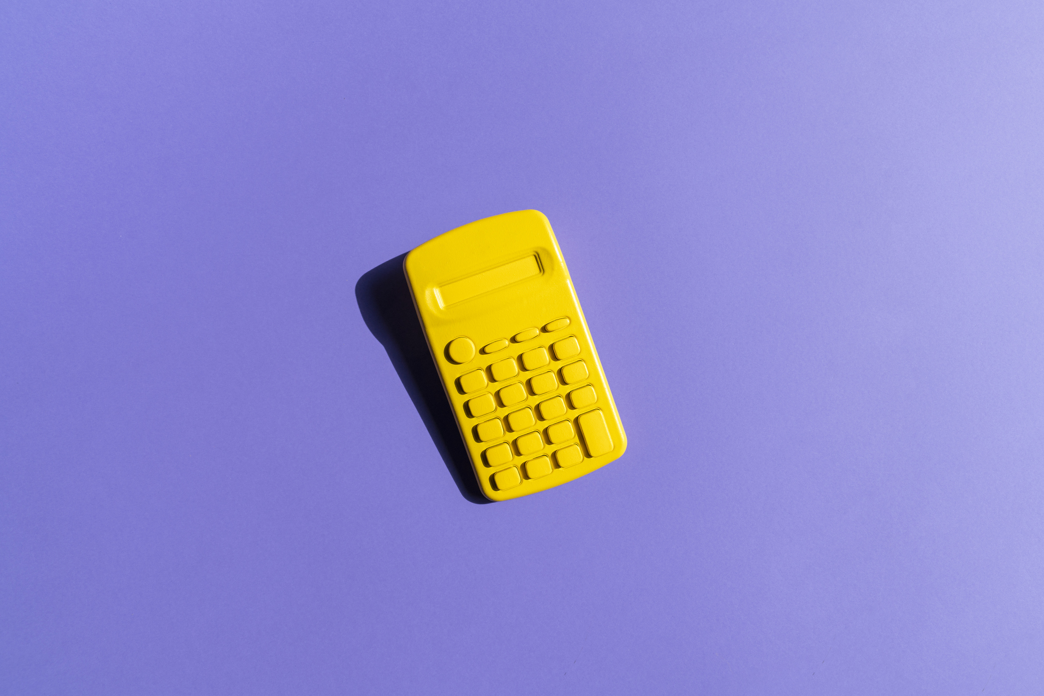 Yellow calculator on a purple background;  a financial model for forecasting fundraising
