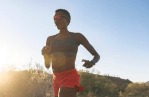 A runner wearing a Garmin 955 Solar running watch.