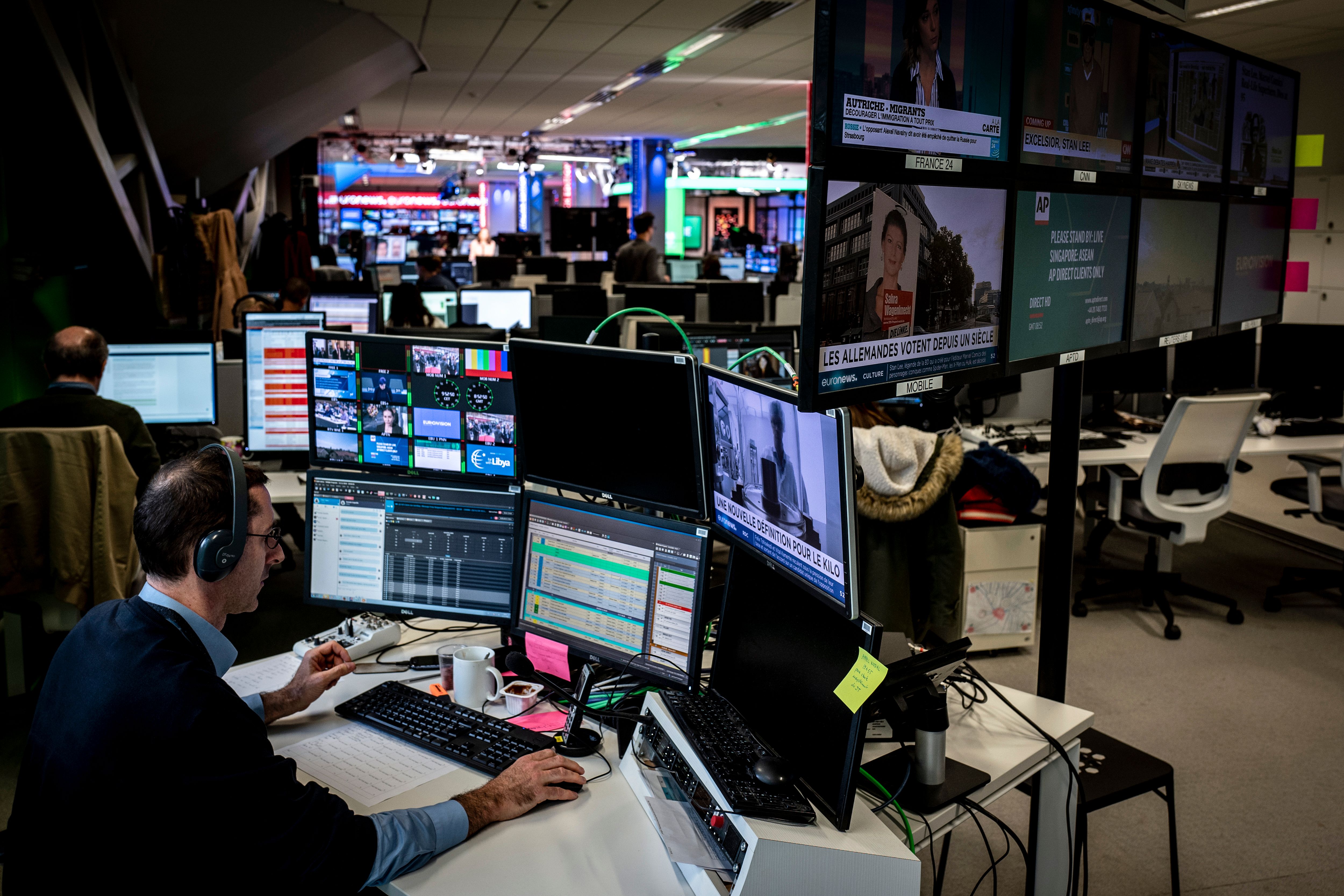 A newsroom in Europe with computer screens