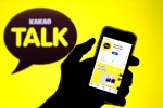 In this photo illustration, the KakaoTalk app in App Store seen displayed on a smartphone screen and a KakaoTalk logo in the background