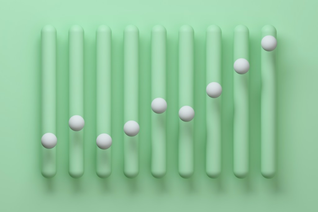 Digital generated image of abstract vertical bar chart made out of smooth round green vertical bars with white spheres on each bar on green background.