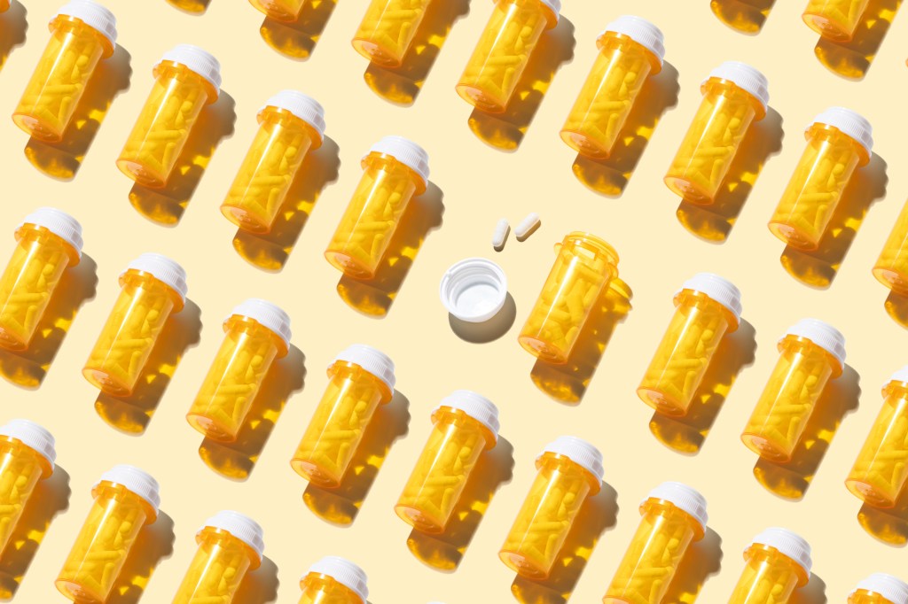 Pill bottles on a patterned background