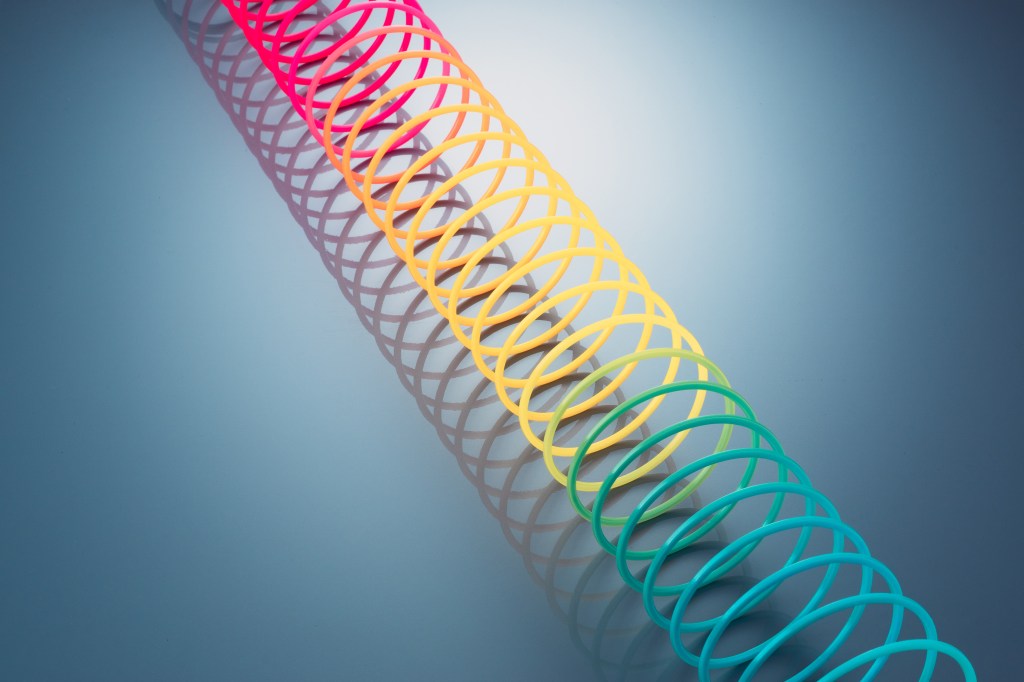 Image of a stretched colorful Slinky.