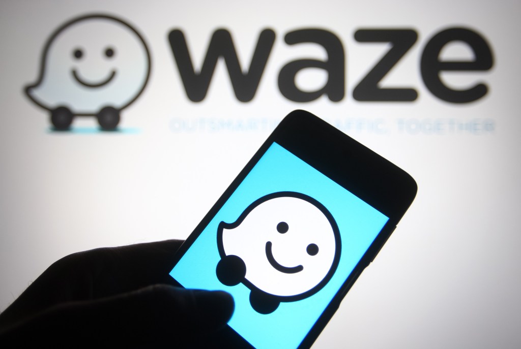 In this photo illustration a Waze logo of a GPS navigation