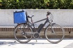 Image of an electric bicycle for deliveries parked outdoors.