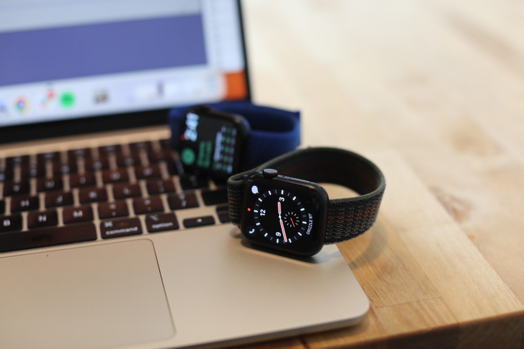 smartwatch on laptop